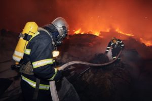 Firefighters during extinguishing fire of building